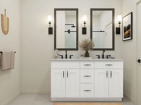 Primary bath with black-framed mirrors and matte black fixtures