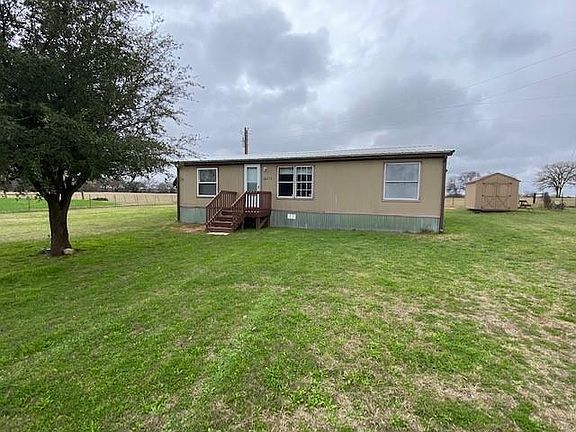 Front with storage shed