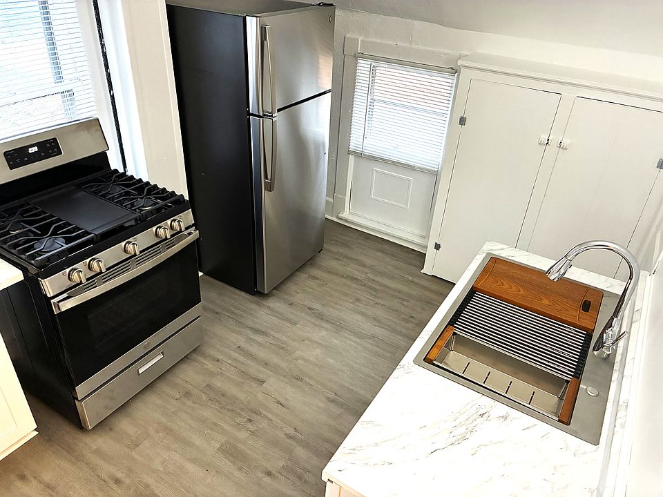 New stainless steel gas range, and new fridge/freezer. New stainless steel sink, faucet, and marble countertops.