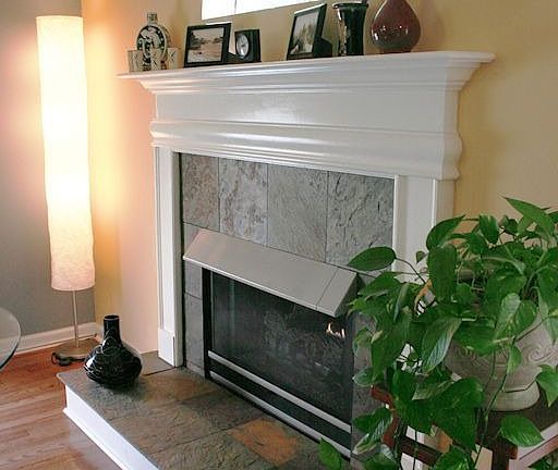 Gas log stone tiled fireplace & accent window...