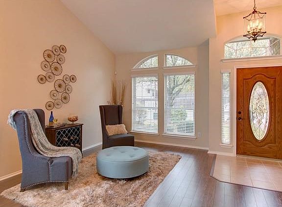 Formal living area or reading nook with plenty of natural light.