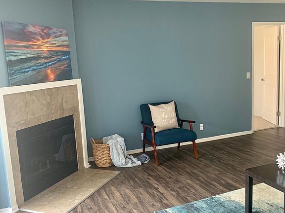 Living Room with Wood Burning Fireplace