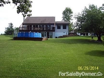 Front of the house.
						:
						Decks on both the front and side of the house.