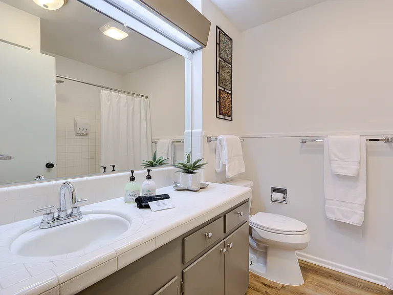 This not an updated picture. There is a quartz countertop and new faucets. The tile in the bathtub was also updated.