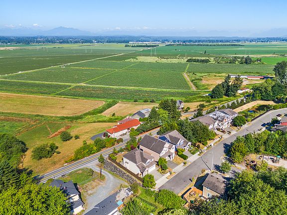 View of Blueberry Farm and Cascade Mountains. Beautiful playground near the home.