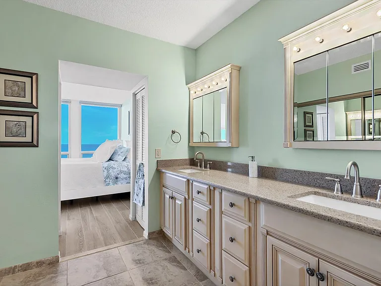 Double vanity with expansive counter space and storage in primary bath