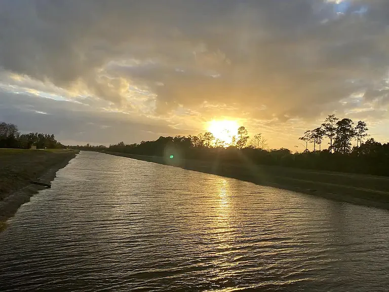This canal is at the end of the block and has a trail that leads you to Riverbend park (1 miles away).
