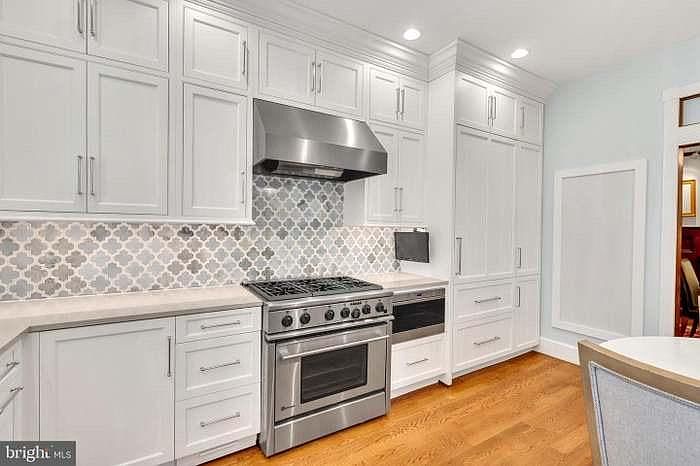 Recently updated kitchen with built in sub zero refrigerator, large 6-burner range and lots of storage space