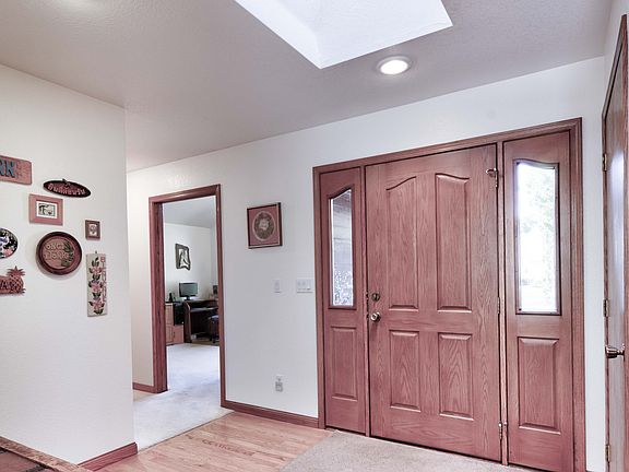Foyer with skylight and coat