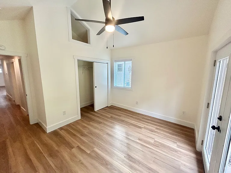 Primary bedroom with access to back deck