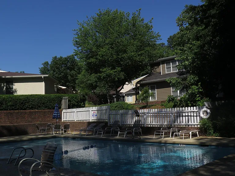 home overlooks this swimming pool that is rarely used!