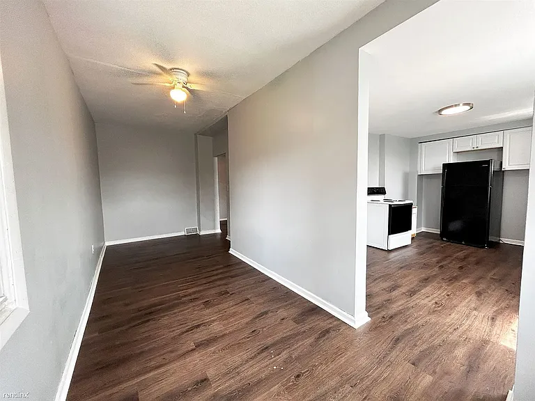 Corner of dining room side area showing kitchen