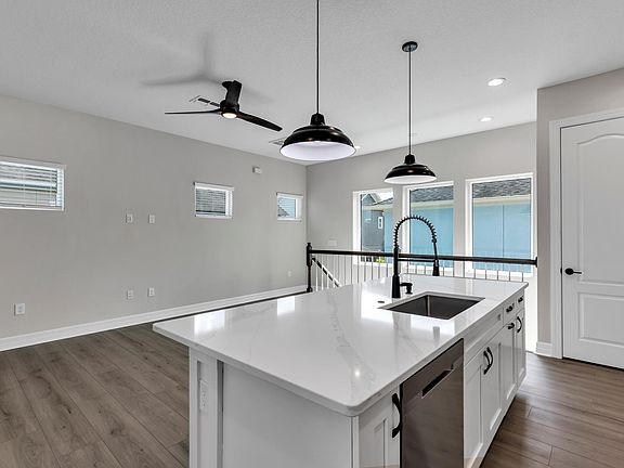 View of kitchen island facing south west from next to the fridge. Tons more storage.