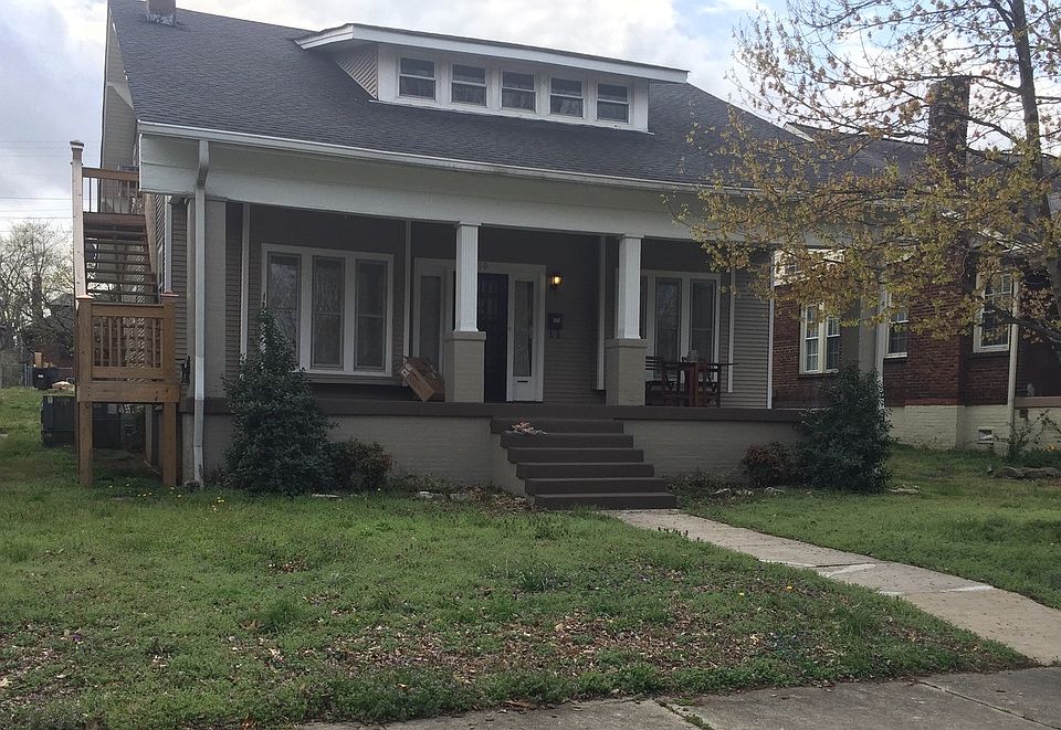 Upstairs entrance on left side of porch