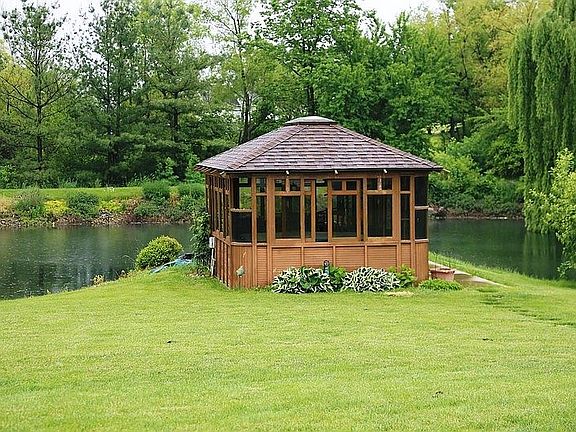 Backyard
						:
						Gazebo with Hot tub overlooking the private stocked pond.