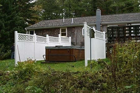 Hot tub with privacy fencing