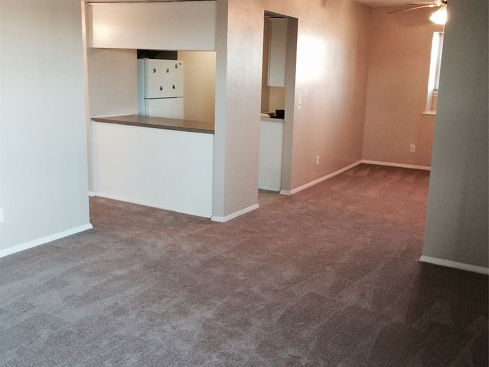 Large living room looking into the kitchen and dining room