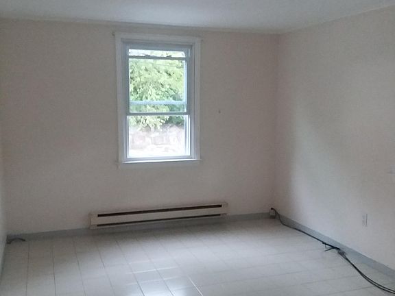 Living area with three full size windows.