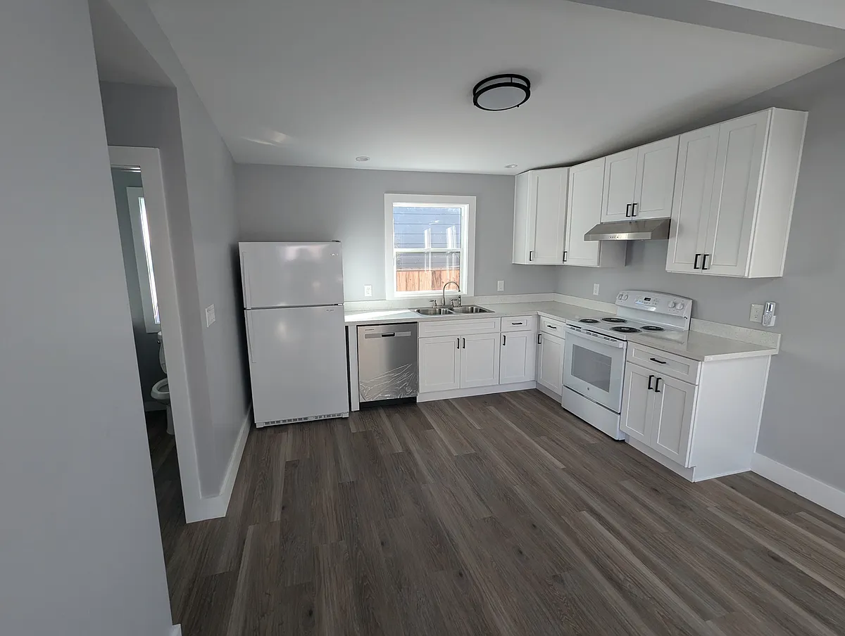 Brand new kitchen with new stove, sink, refrigerator, and dishwasher. - 821 61st St