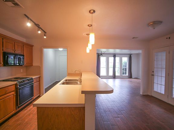 Kitchen; open floor plan into the living room.