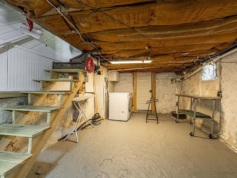 laundry folding table can remain! plenty of room to put your workout equipment down here.