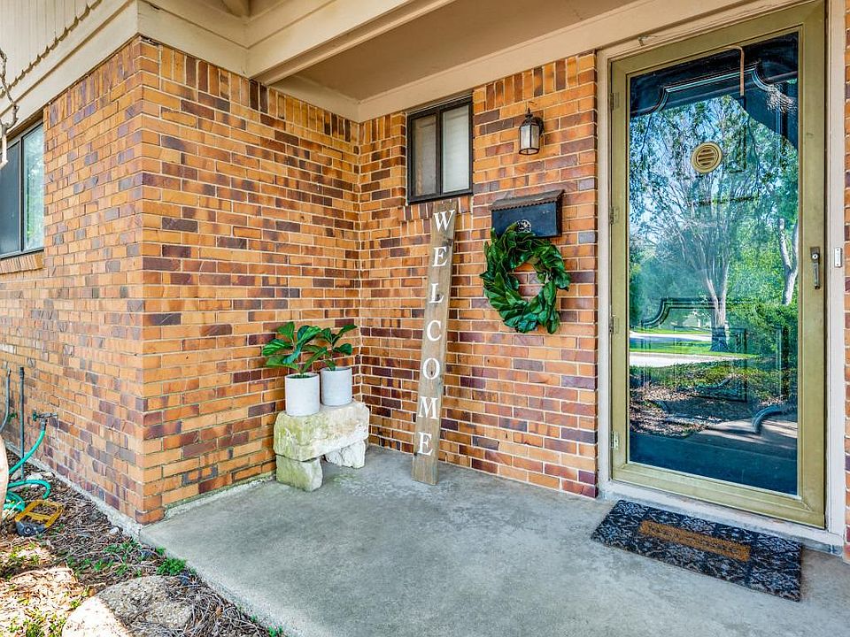 All brick home features a two car garage and remotes.