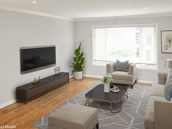 Spacious living room ( shown virtually staged)