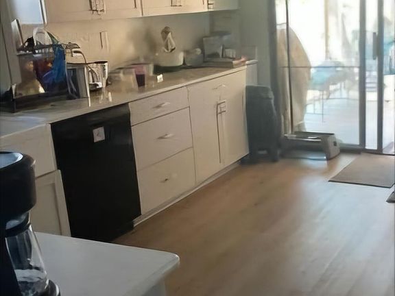 Brand new kitchen cabinets and flooring