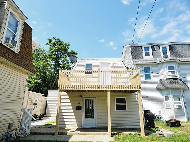 front of the house- really set back off the street and open space to the right (neighbor's house to the left is very close, nice people)