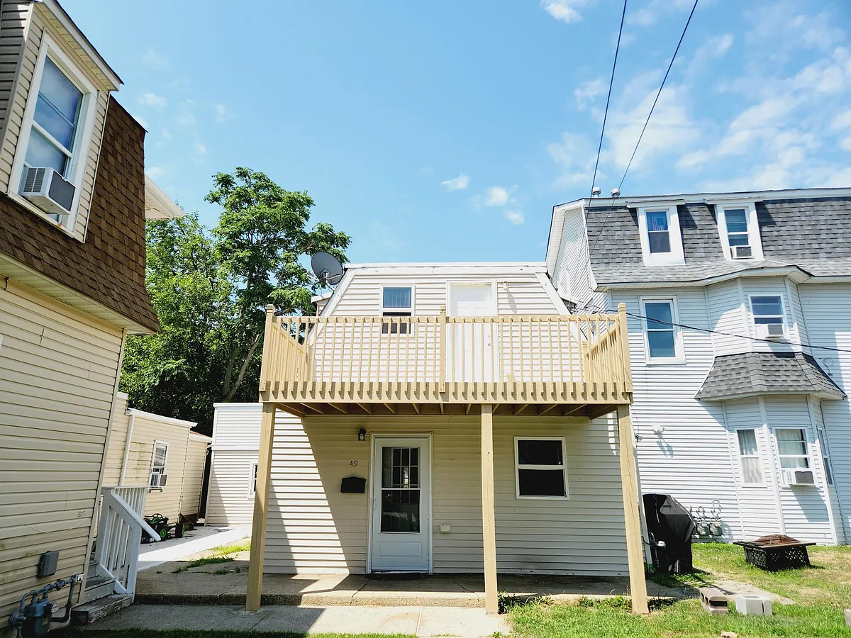 front of the house- really set back off the street and open space to the right (neighbor's house to the left is very close, nice people) - 49 Highland Ave