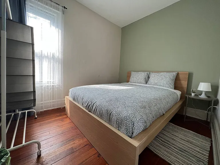 Bedroom #1 with queen bed & wardrobe.
