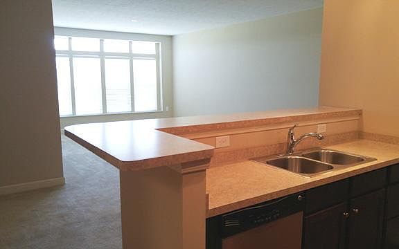 Large windows in living room let in the morning sun