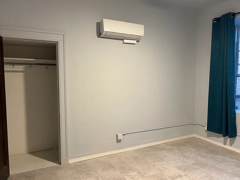 Bedroom #2: AC/heating unit and closet