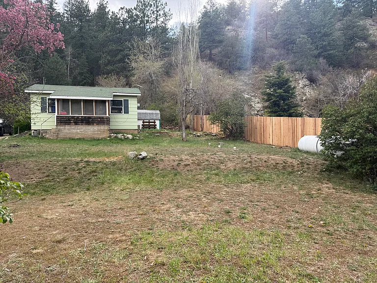 There are neighbors to the right and left of the cabin.