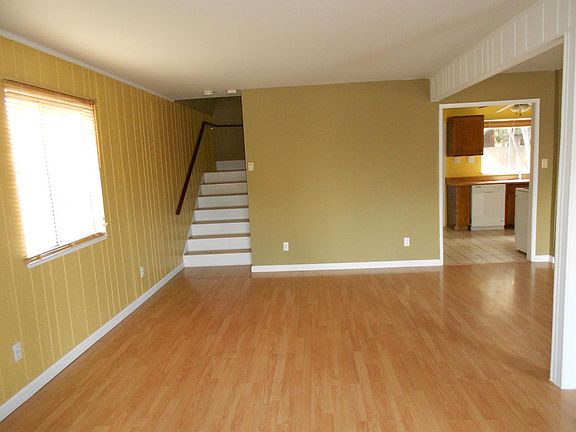 downstairs dining/living room combo - stairs to second floor