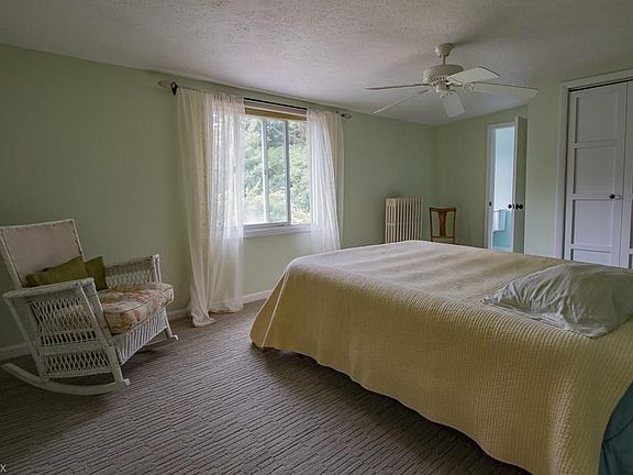 The carpeted 2nd Floor Master Bedroom is spacious with spectacular views of the rear yard.