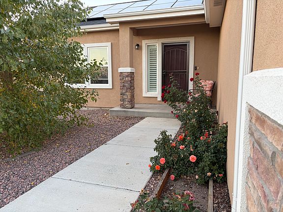 South facing entrance and driveway.