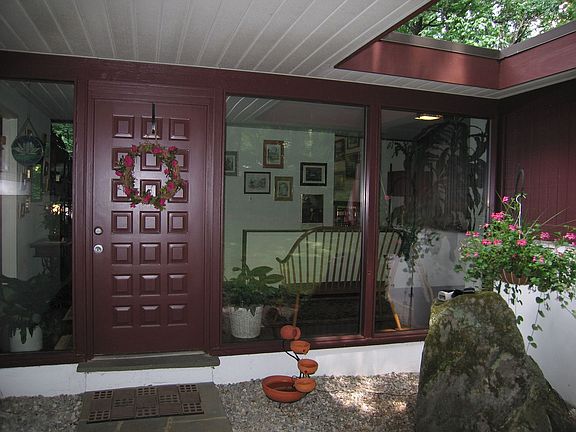 Formal entry leads to large foyer and then into living room