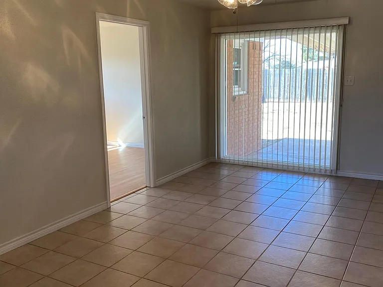 Dining area. Custom paint and nice view to the huge backyard.