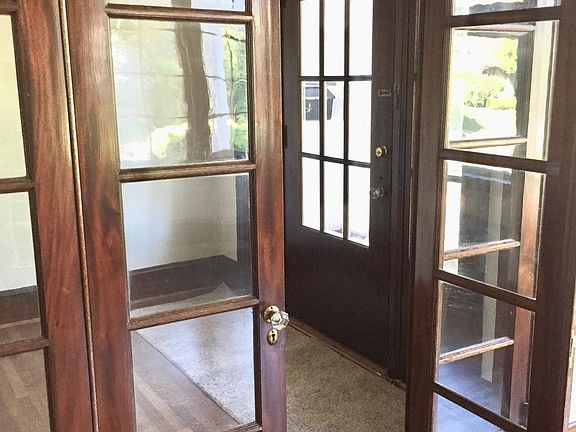 French doors separating the entryway from the living room