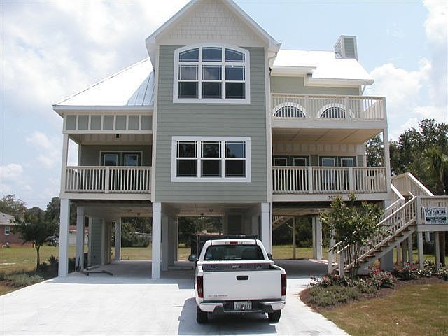 Front Elevation - View from driveway and corner of 19th St and Palm Blvd