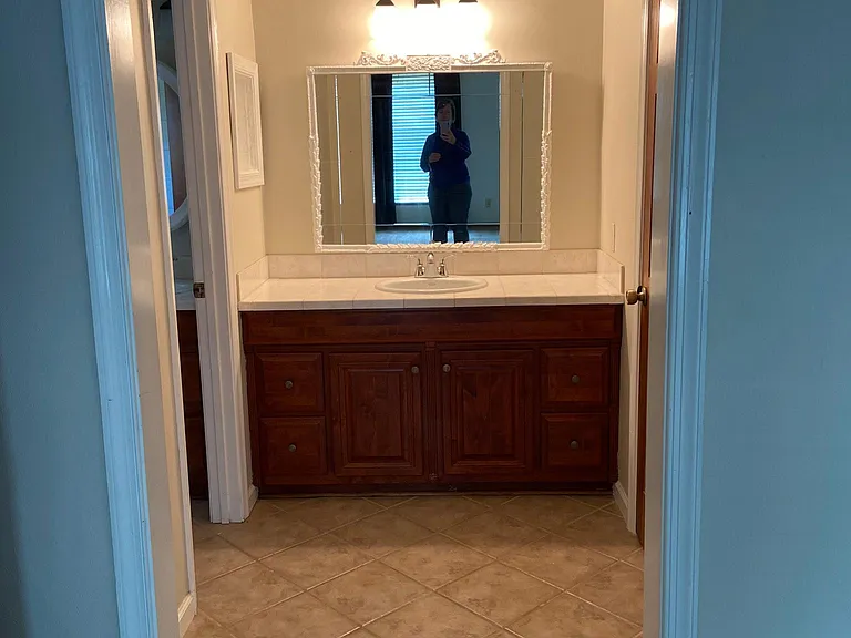 Off of master bedroom. Bathroom with whirlpool tub to the left and large closet to the right.