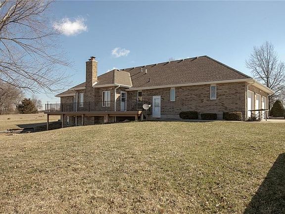 All brick ranch style home with walk out lower level.  Two entries to basement.  One from back hall to garage and one from great room.