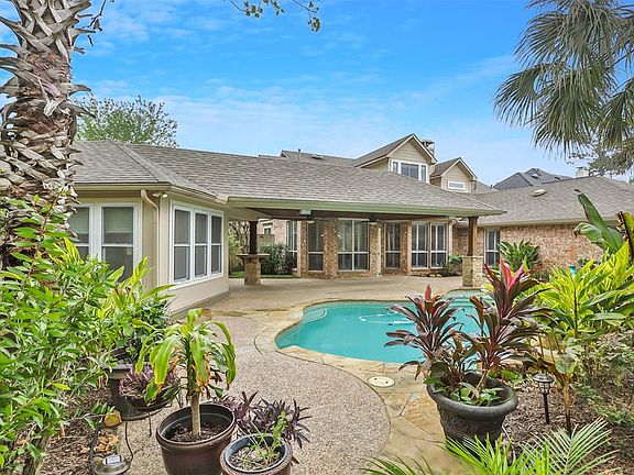 Lushly landscaped backyard oasis! Large Covered patio!