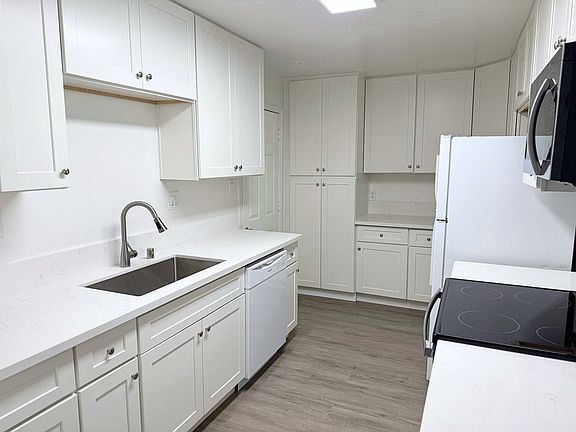 Fully updated kitchen with new countertops and appliances.