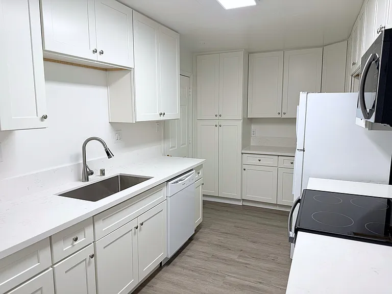 Fully updated kitchen with new countertops and appliances.
