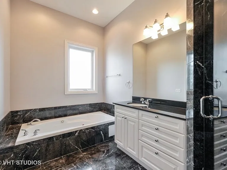 Master Bathroom, Jacuzzi hot tub, and a shower