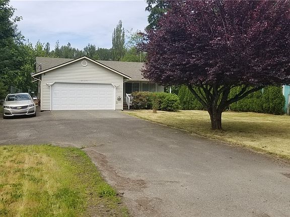 Deep wide driveway allows for RV parking along with multiple cars.
