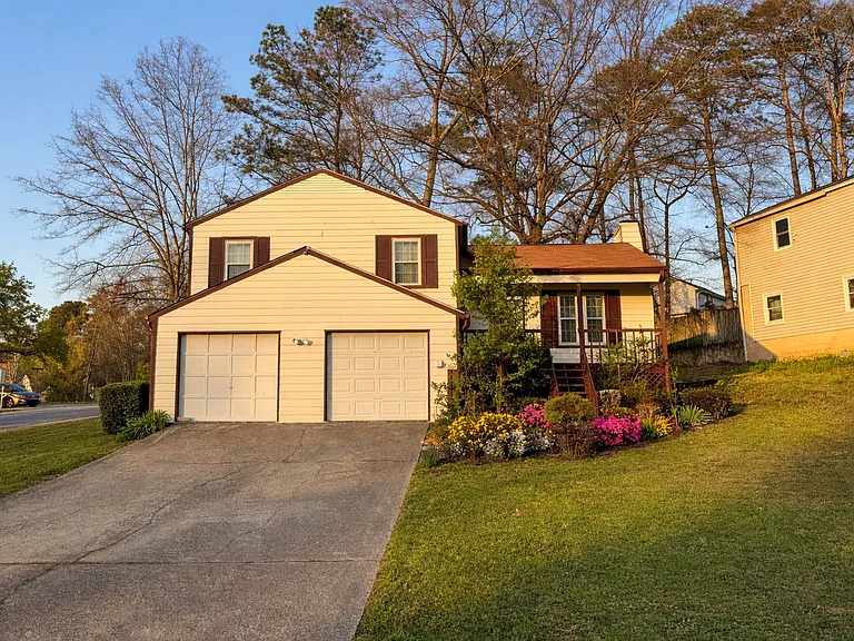Front of the house. 4 car driveway.