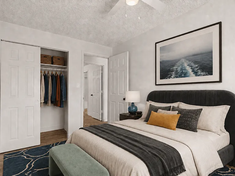 Comfortable bedroom with generous closet storage in a two-bedroom apartment at Palisades Apartments.
